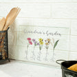 a kitchen counter with utensils and a sign that says grandma&#39;s garden