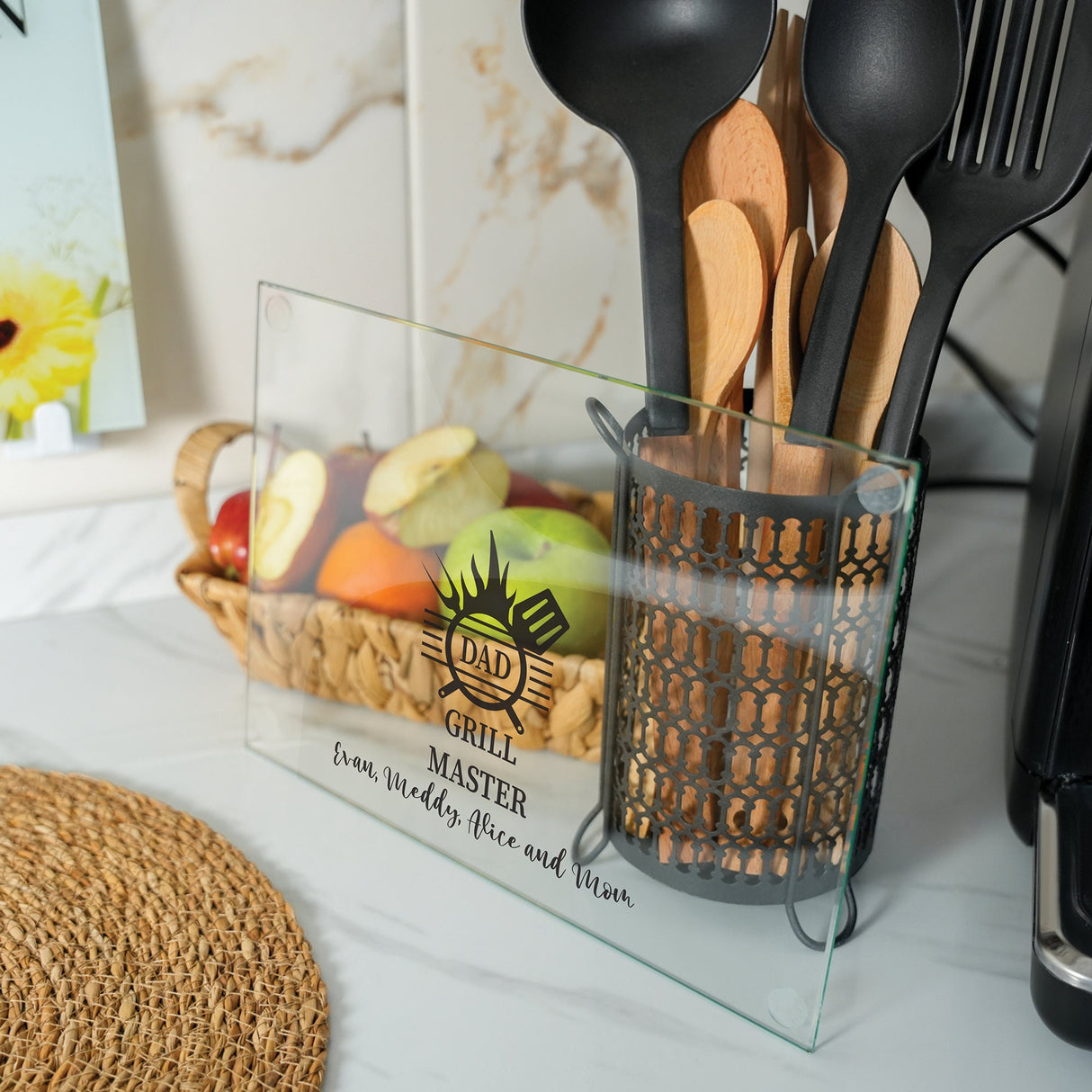 utensils in a glass holder on a counter