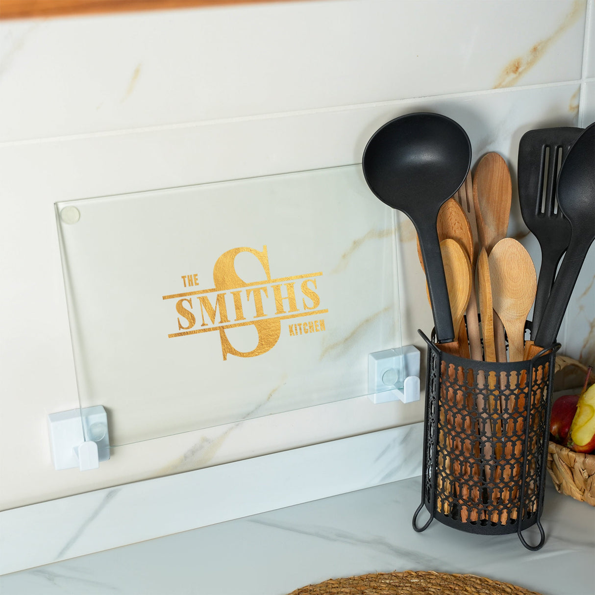 a bunch of spoons and spatulas in a holder