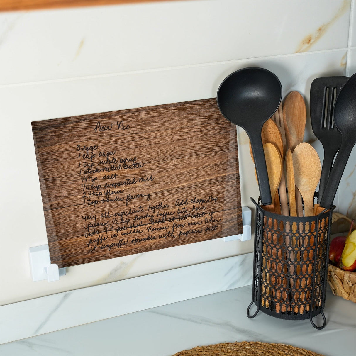 a picture of a kitchen with utensils in a holder