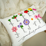 a pillow that has a bunch of flowers on it