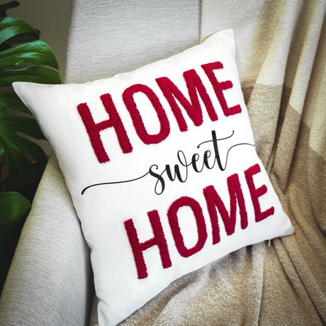 a pillow that says home sweet home on it