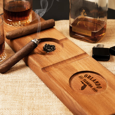 a wooden cutting board with a cigar on it