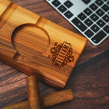 a wooden business card sitting on top of a wooden table