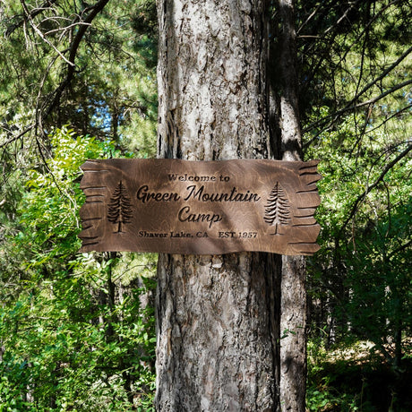 a sign on a tree that says green mountain campground