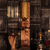 a wooden bottle opener with a hand holding a cigar