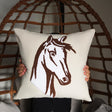 a person holding a pillow with a horse drawn on it