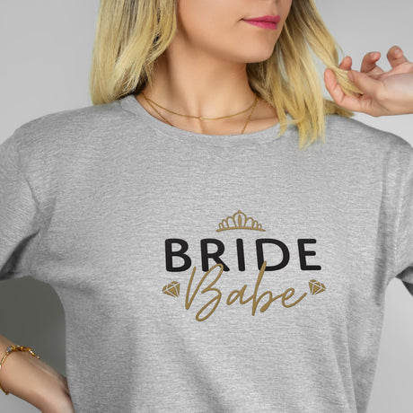 a blonde woman wearing a bride babe t - shirt