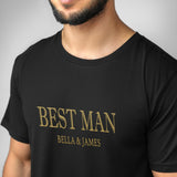 a man wearing a black t - shirt with the words best man on it