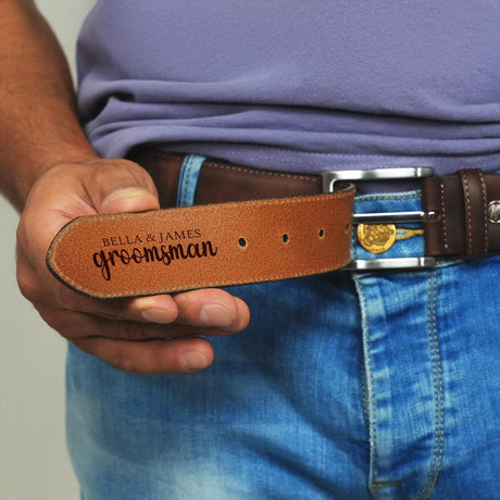 a man wearing a belt with a name tag on it