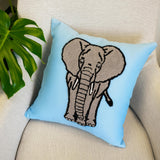 a blue pillow with a picture of an elephant on it