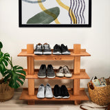 a wooden shelf with shoes on top of it