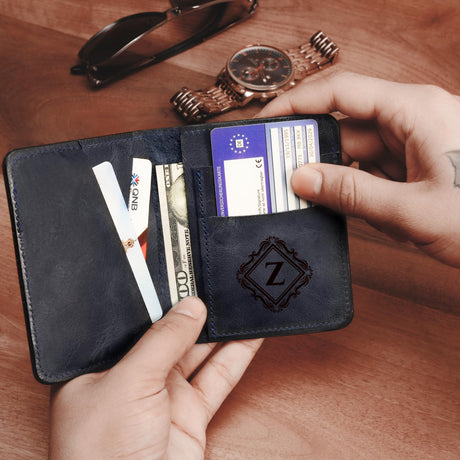 a person holding a wallet with a credit card in it