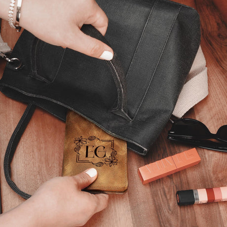 a person holding a purse next to some lipstick