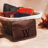 a personalized leather wallet sitting in a basket