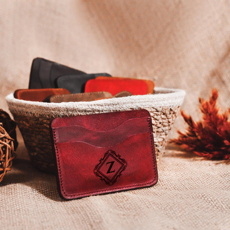 a red leather wallet sitting on top of a table