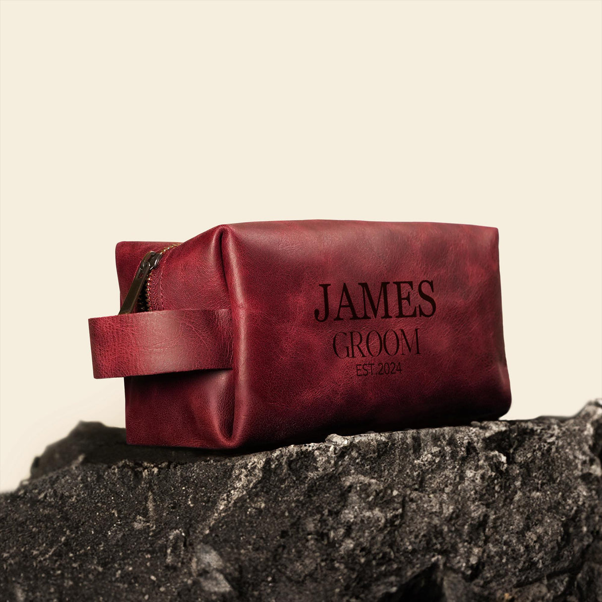 a red bag sitting on top of a rock