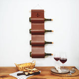 a wooden table topped with a wine rack and two glasses of wine