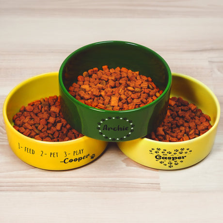 three bowls of food sitting on top of a wooden table