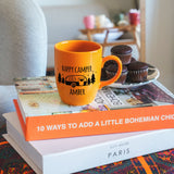 a stack of books sitting on top of a table next to a cup of coffee