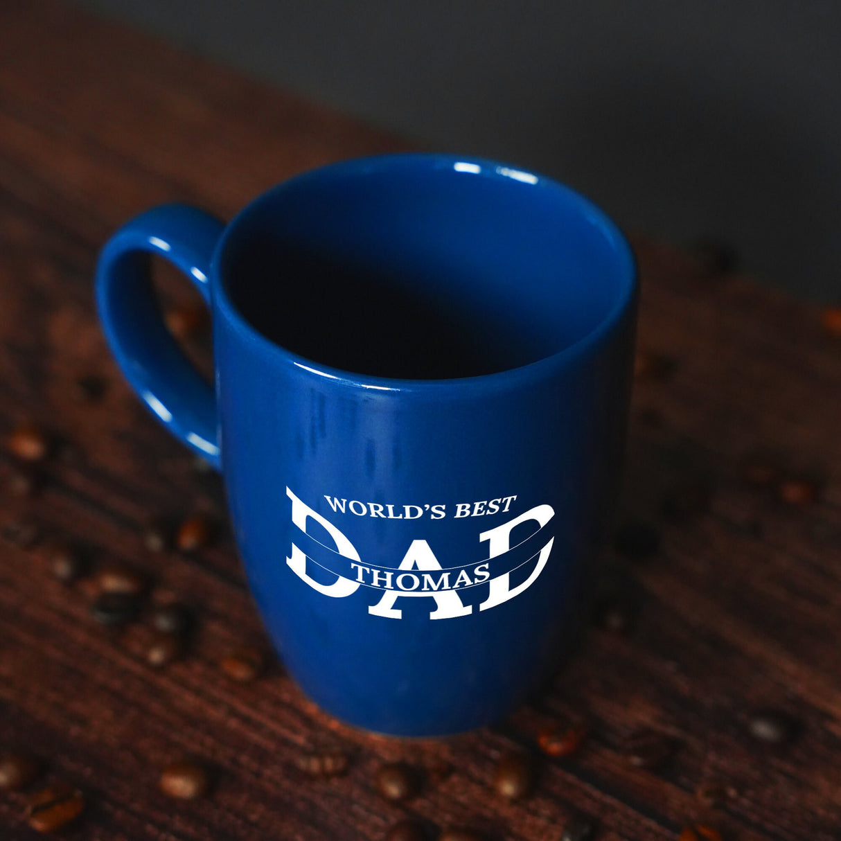 a blue coffee mug sitting on top of a wooden table