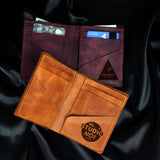 two wallets sitting next to each other on a black cloth