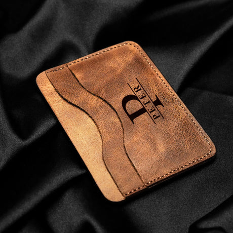 a leather wallet with the letter d on it