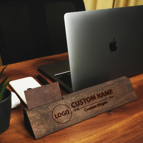 a wooden business card sitting on top of a desk