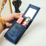 a person holding a blue case with a lighter in it