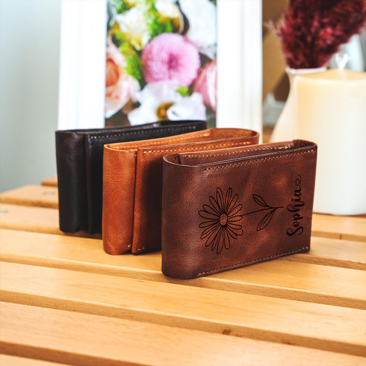 a couple of wallets sitting on top of a wooden table