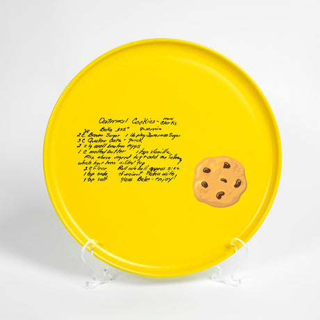 a yellow frisbee with a picture of a cookie on it