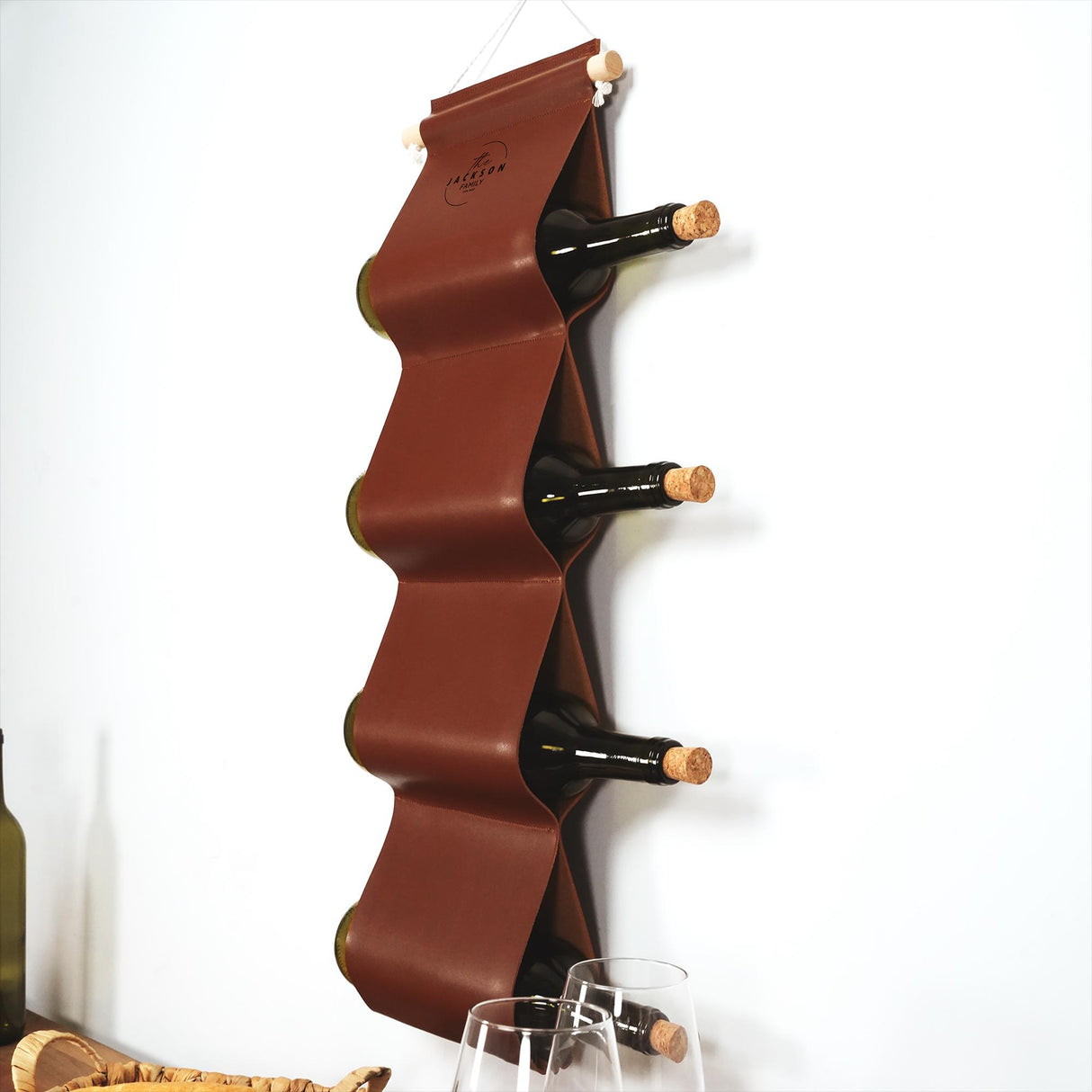 a wall mounted wine rack with wine glasses