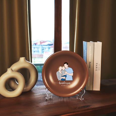 a plate with a picture of a man and woman on it next to a book