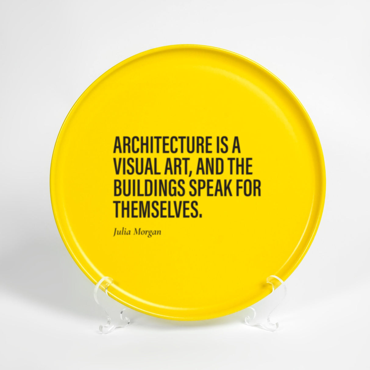 a yellow plate with a quote on it