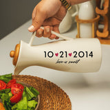 a person pouring a salad into a bowl