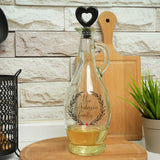 a glass decanter with a personalized message on it