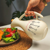 a person pouring a teapot with a salad on a plate