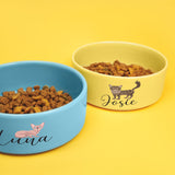 two bowls of food on a yellow and blue background