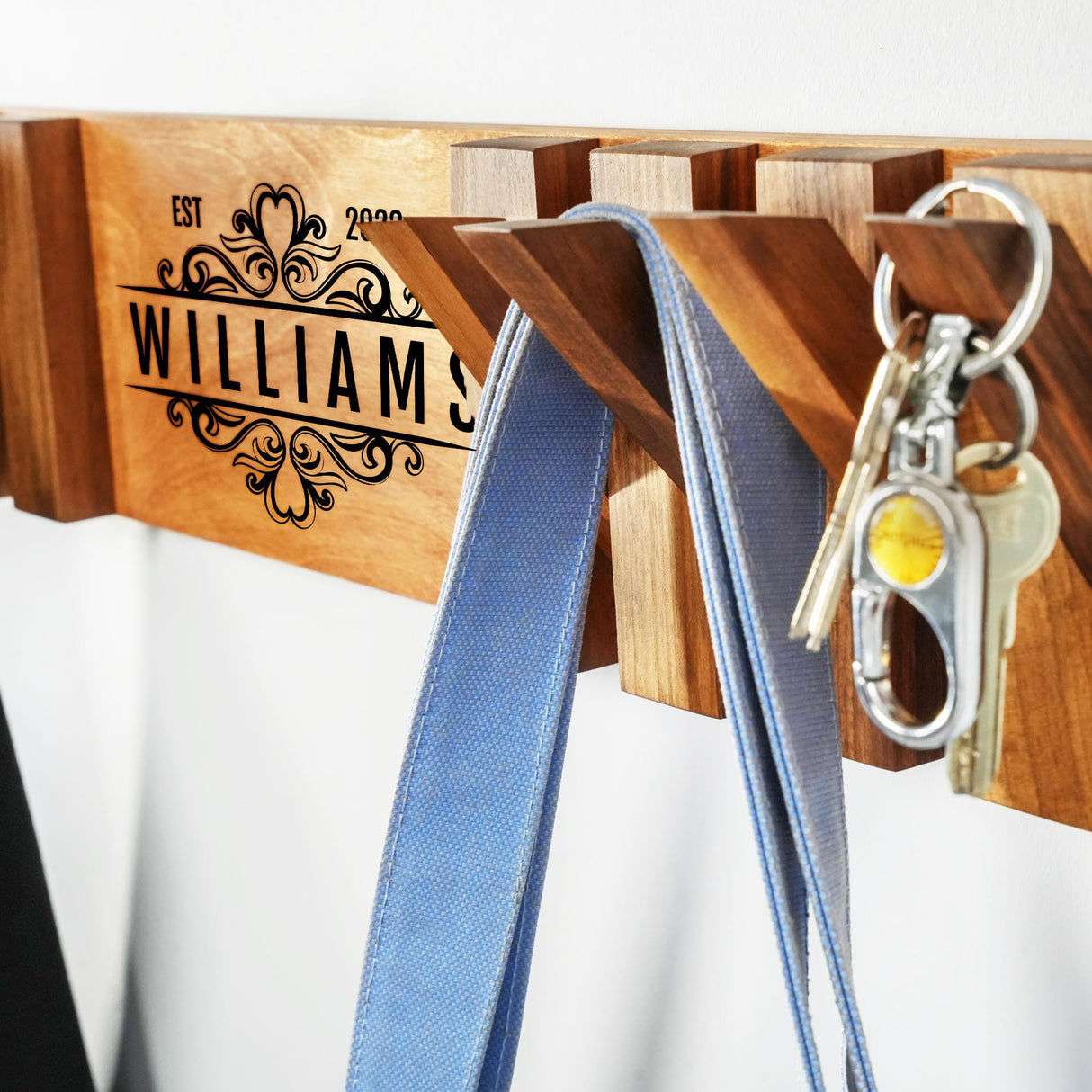 a pair of keys hanging on a key holder