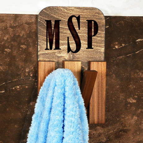 a blue towel hanging on a wooden hook