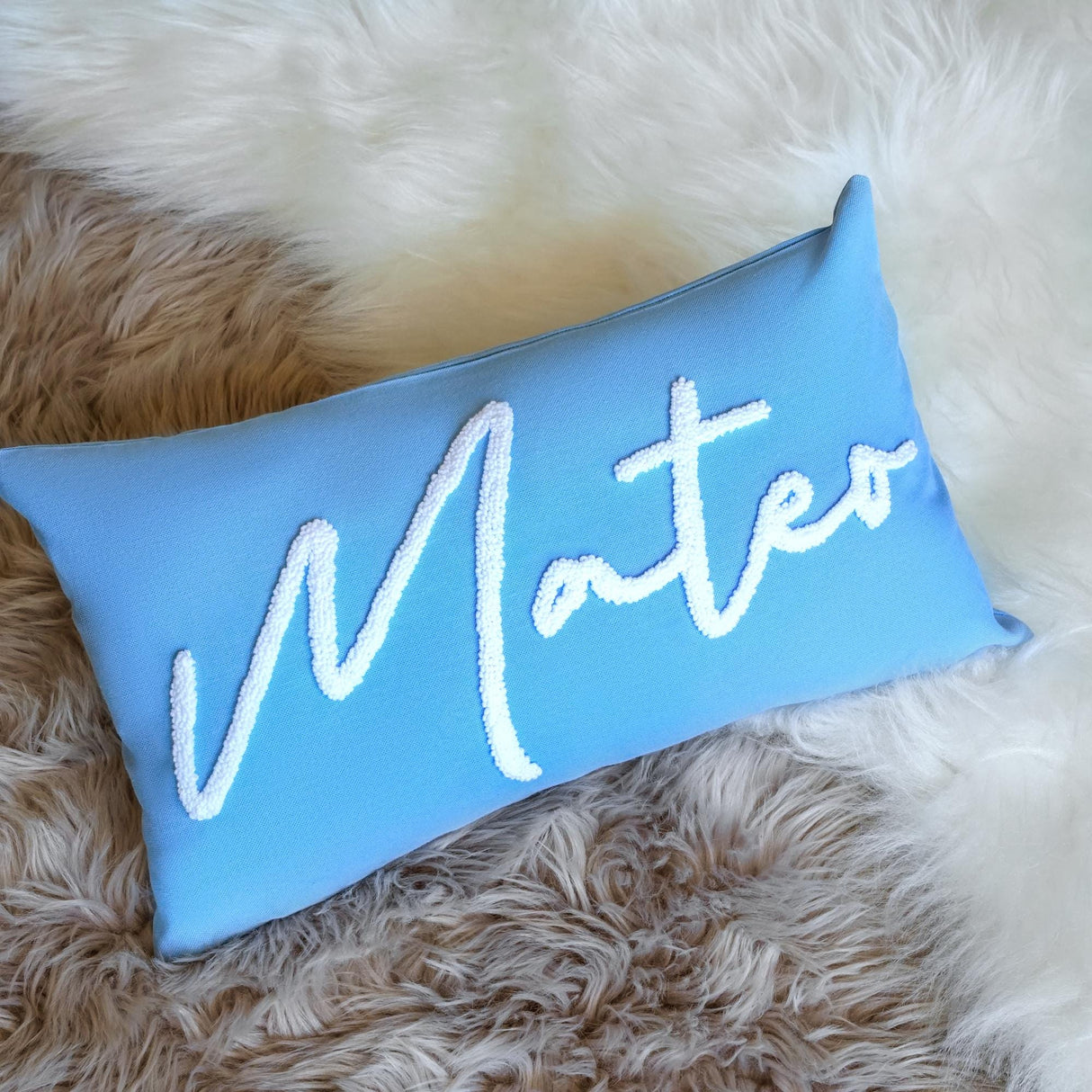 a blue pillow with the word matter written on it