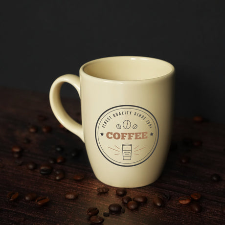 a coffee cup sitting on top of a wooden table