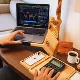 a person sitting at a desk with a laptop and calculator