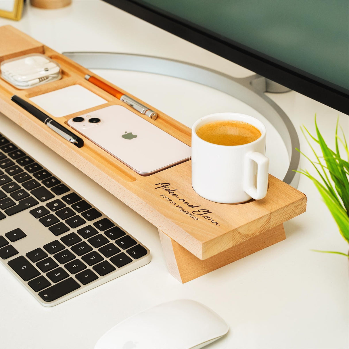 a cup of coffee sitting on top of a desk next to a keyboard