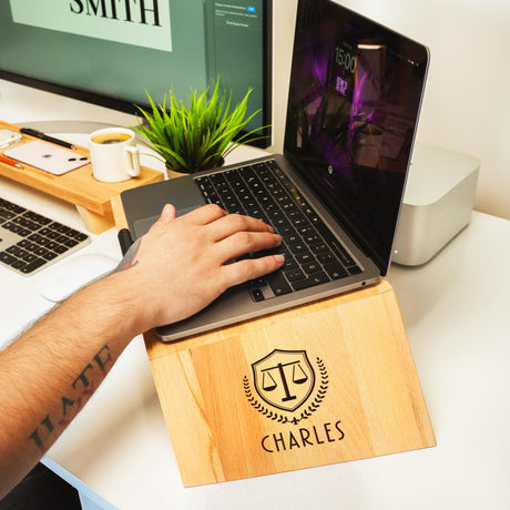 a person using a laptop on a desk