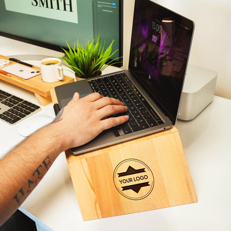 a person using a laptop on a desk