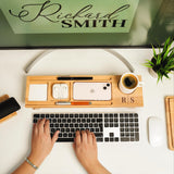 a person is typing on a keyboard on a desk