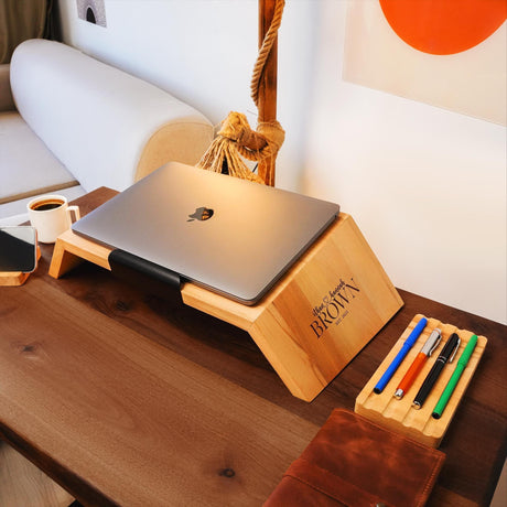 a wooden desk with a laptop on it