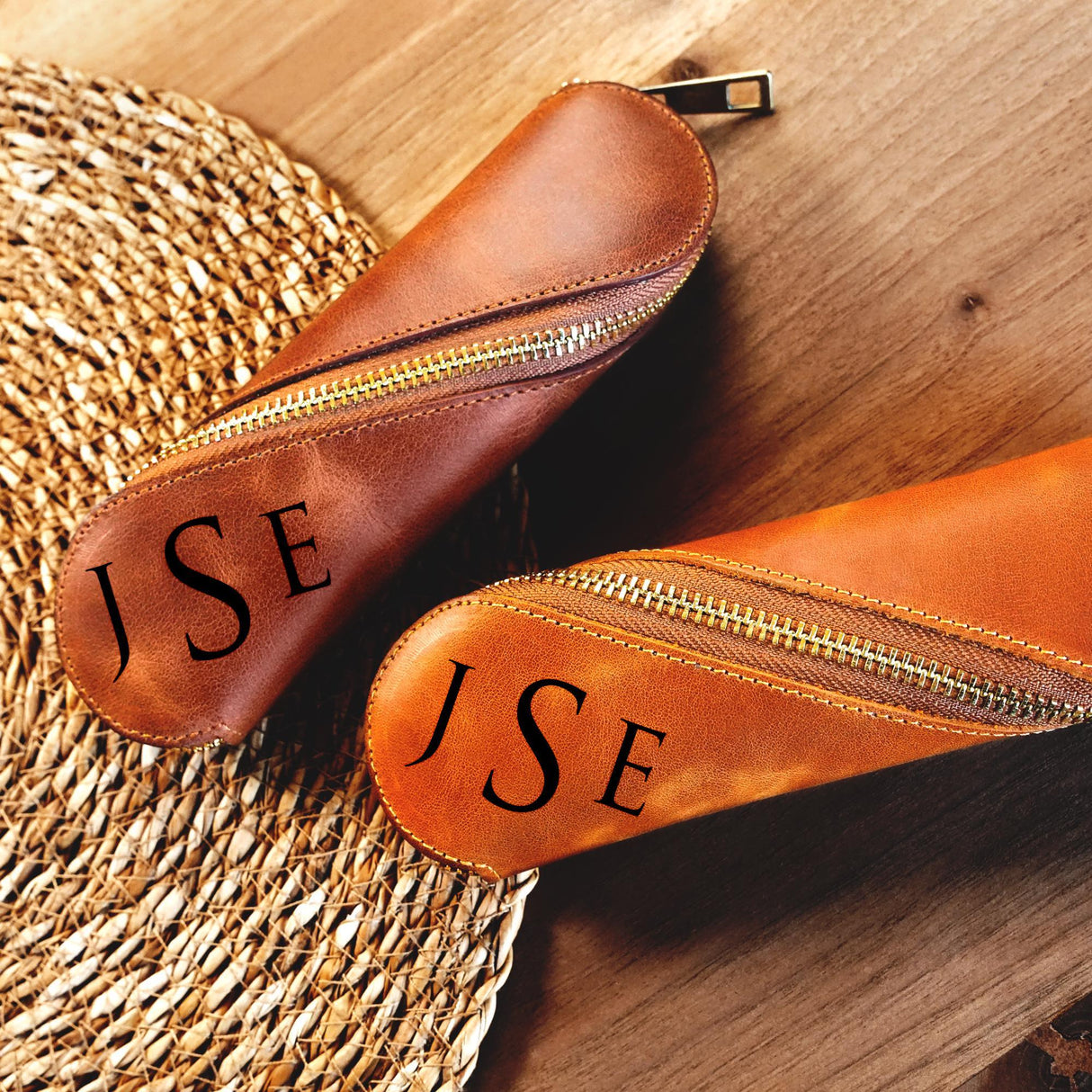 a pair of brown shoes sitting on top of a wooden floor