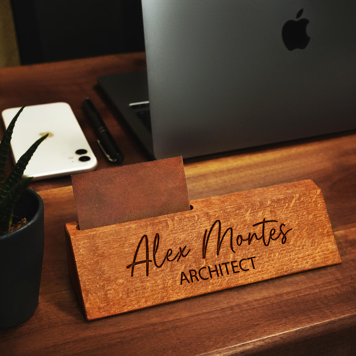 a wooden sign that says alex montes architecture